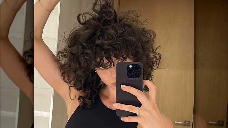 Woman with a curly shag