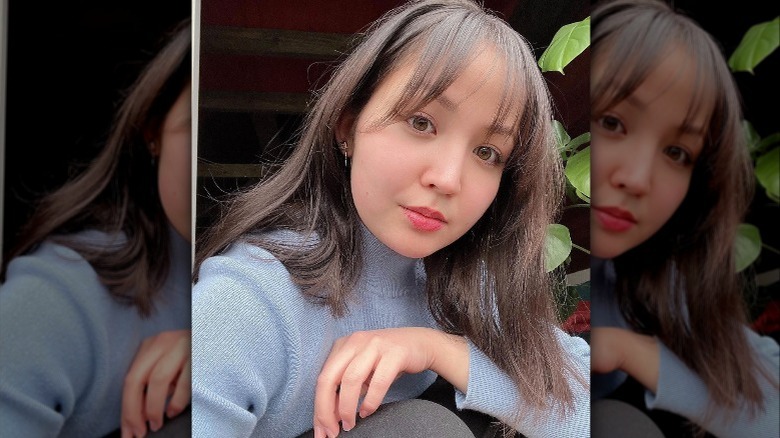 A woman with wispy bangs