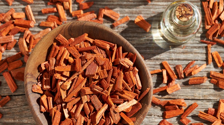 Sandalwood in bowl with oil