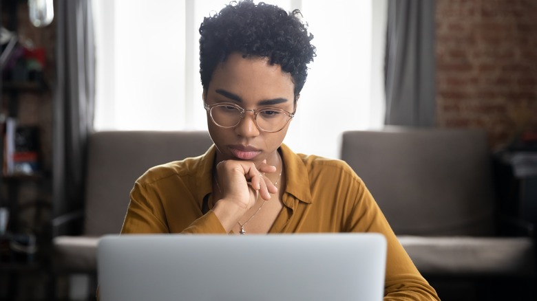 woman researching on laptop