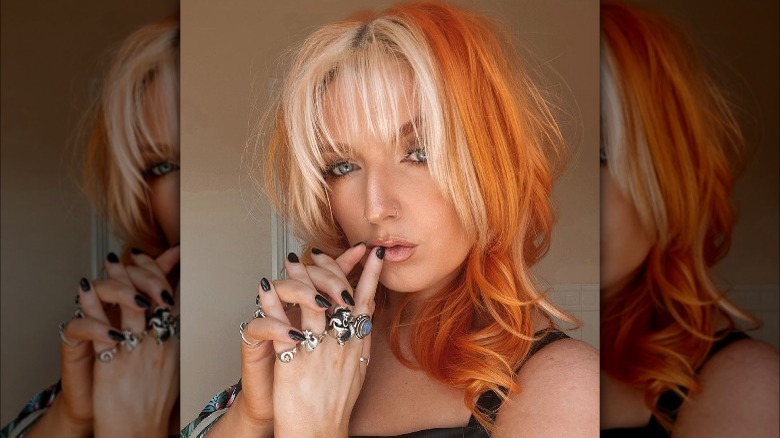 A woman with feathered hair