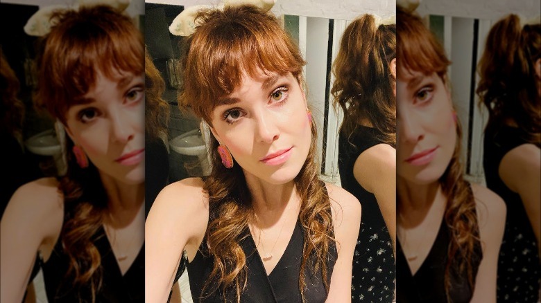 A woman with a half updo