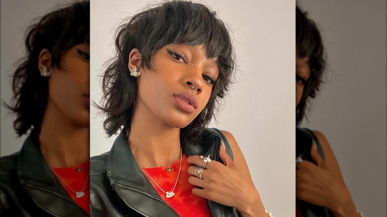 A woman with a mullet haircut