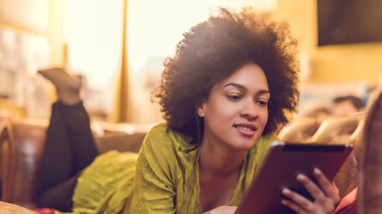 woman reading kindle