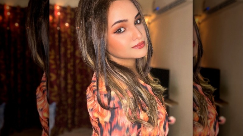 Woman with coral looking makeup