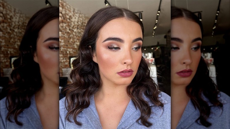 Woman wearing golden makeuo