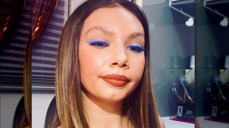 woman wearing blue eyeliner