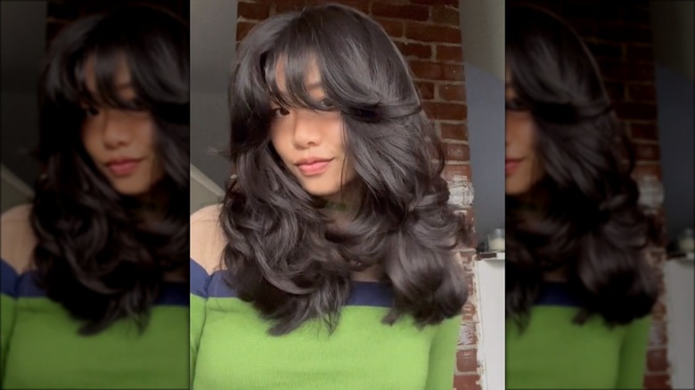 Woman with wavy layered hair