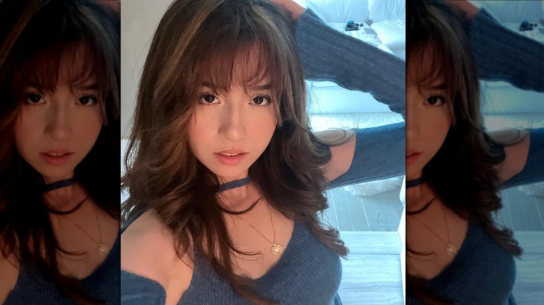 Woman with wavy hair and fringe