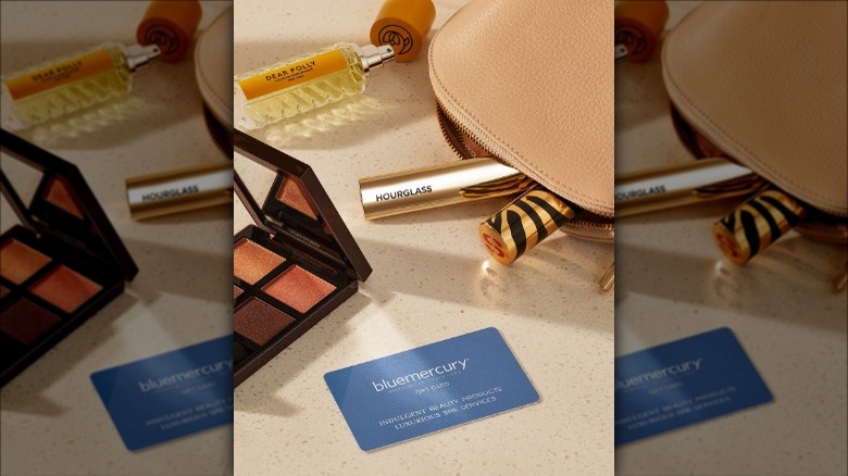 Bluemercury cosmetics displayed on beige table