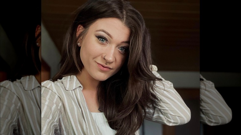 A woman with a wolfette haircut