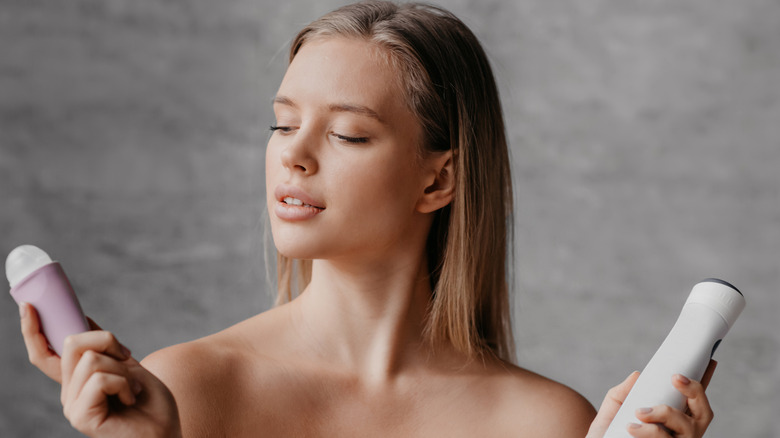 woman choosing a deodorant