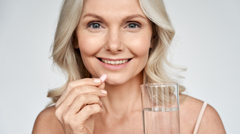 woman taking pill