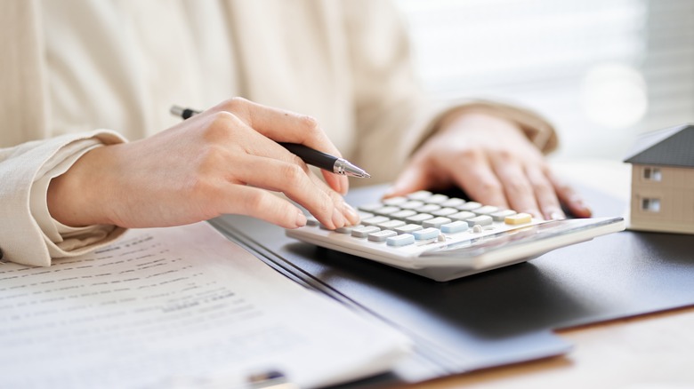 Woman using a calculator