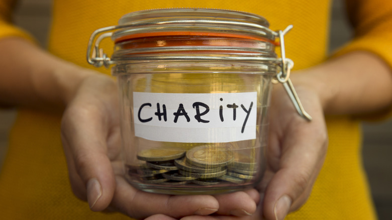 Holding a donation jar