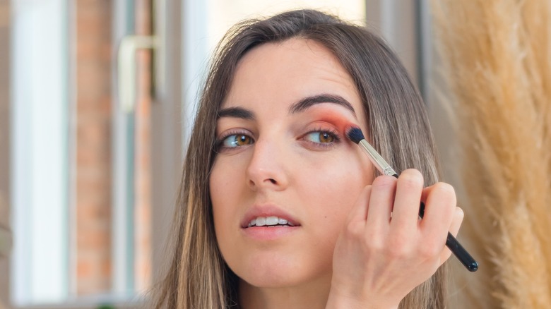 woman blending eyeshadow