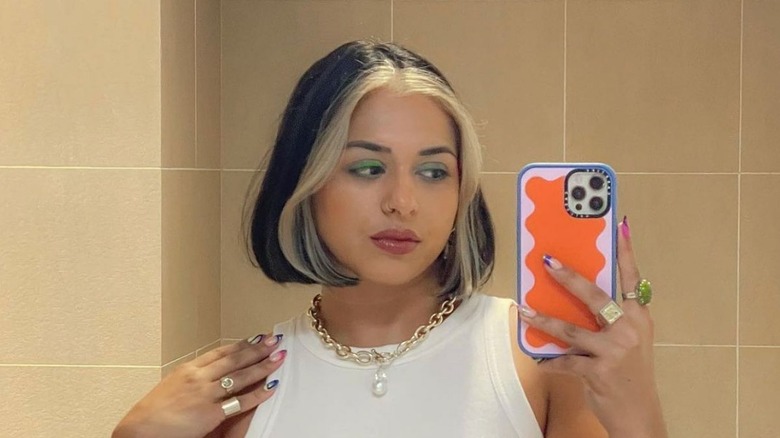 A woman with a two-toned bob/lob