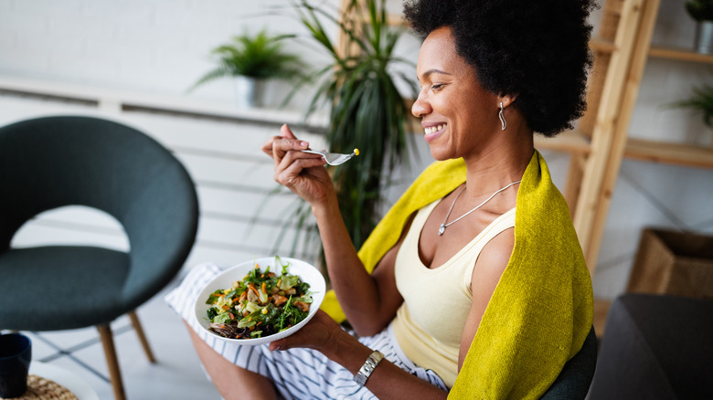 woman eating salad