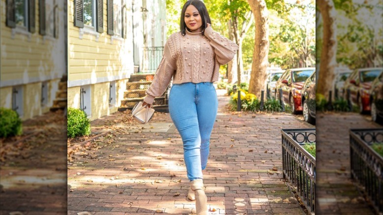 Woman in cropped sweater, jeans