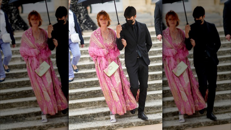 Woman using scarf as jacket
