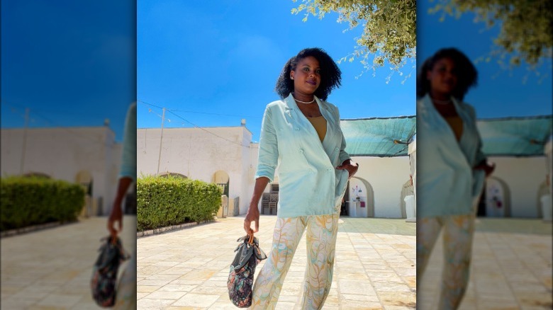 Woman wearing scarf as purse