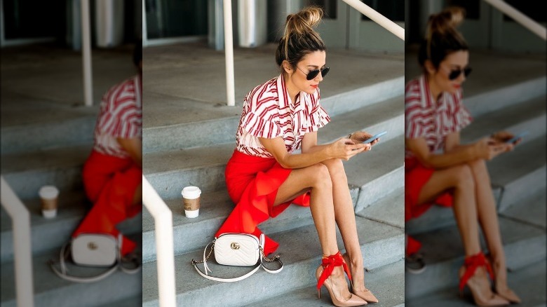 Woman wearing red ankle scarf