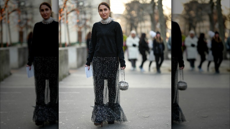 Woman wearing scarf with necklace