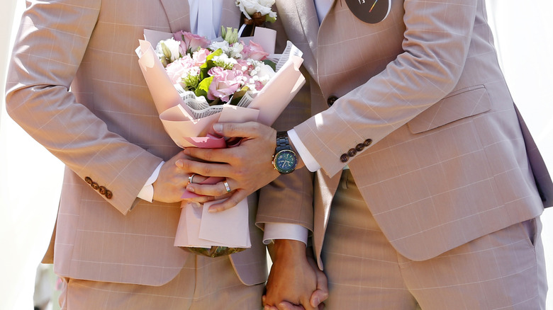 couple holding bouquet