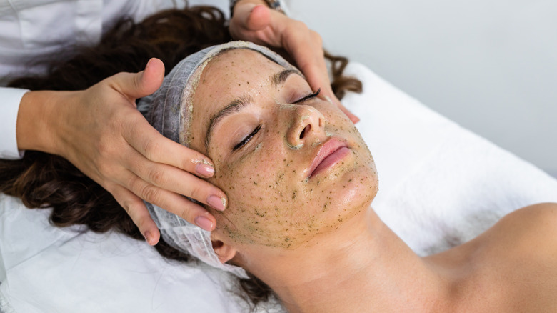 Woman getting seaweed facial
