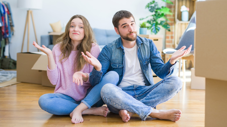 chill couple shrugging 