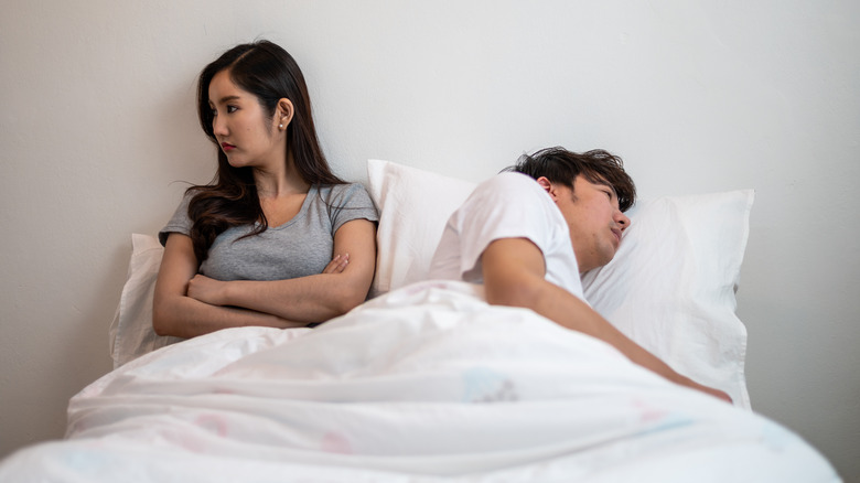 bored couple in bed
