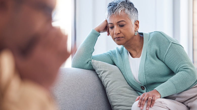 upset woman talking to man