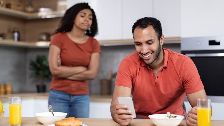 man laughing woman sad