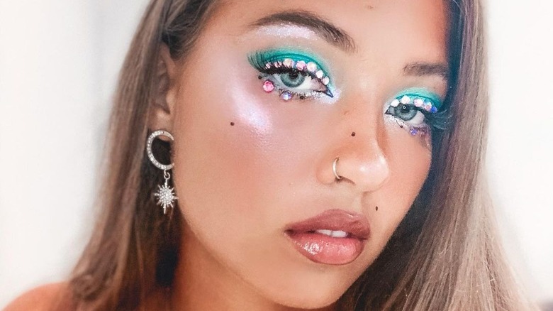 A woman wearing gems