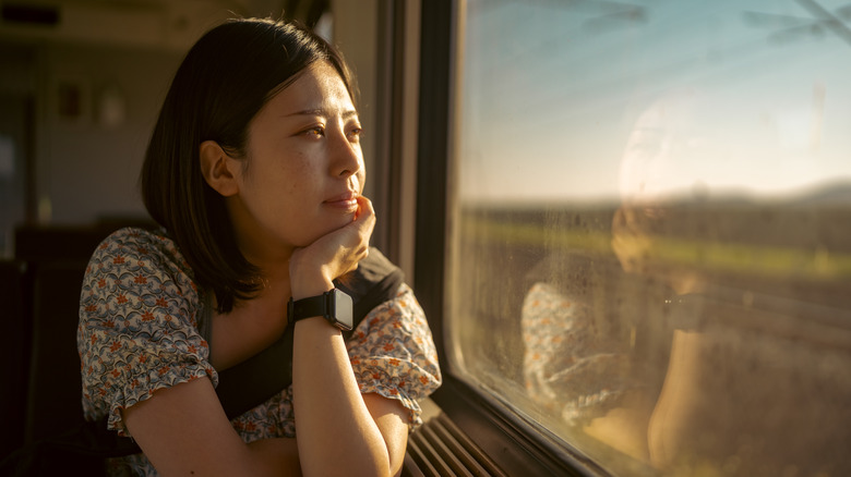 Woman looking out of window