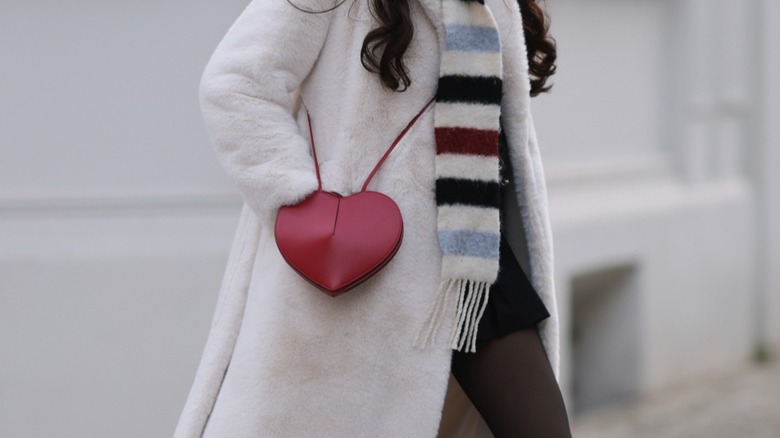 A cross-body heart bag