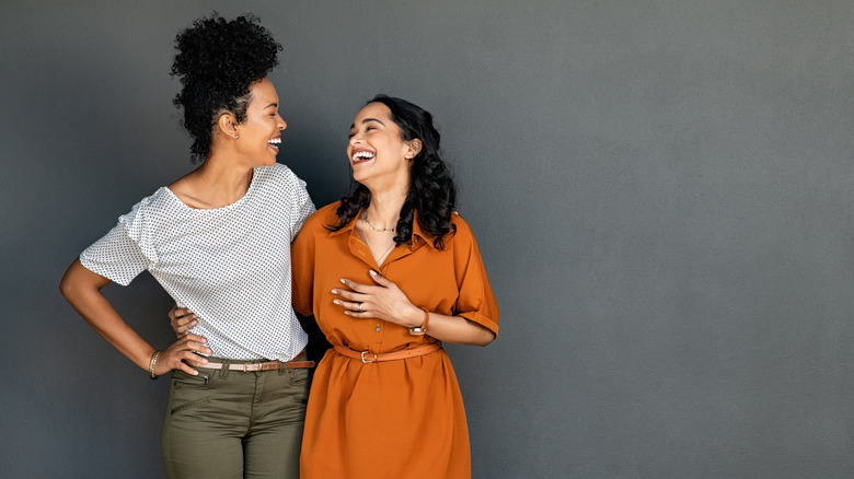 Friends looking at each other smiling