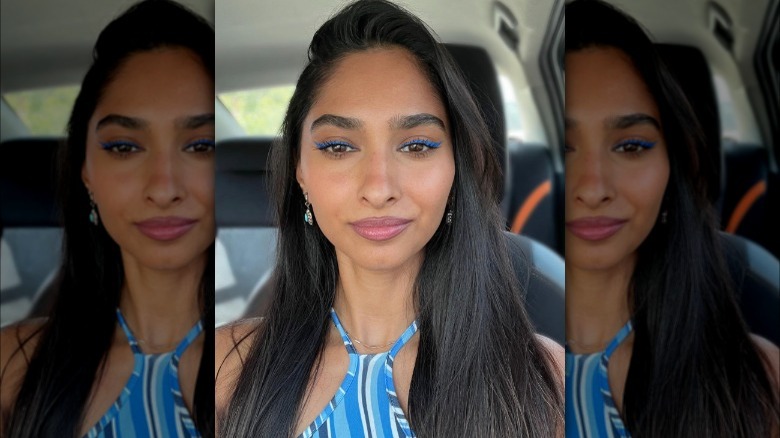 A woman with blue eyeliner