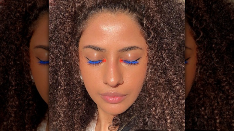 A woman with blue mascara