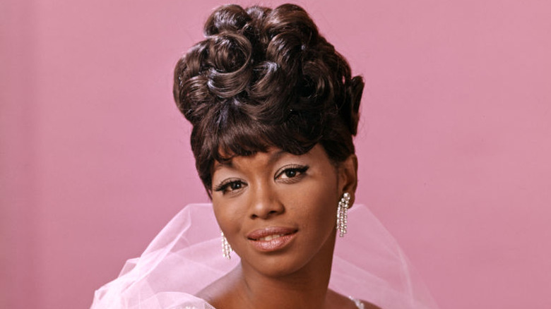 Woman with a curly beehive hairstyle