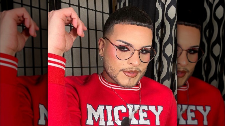 Man with black and red eyeliner