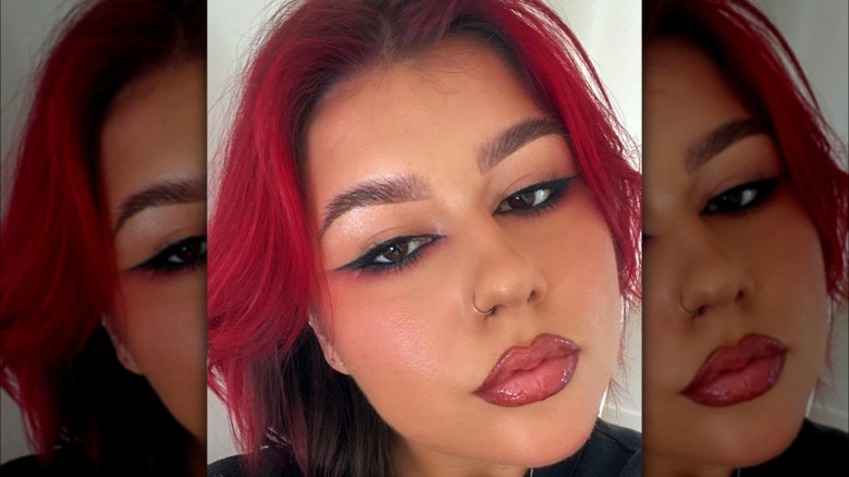 Woman with black and red eyeliner
