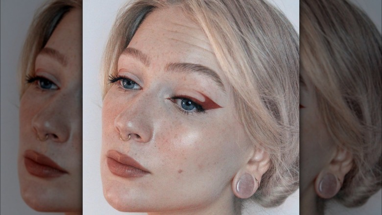 Woman with graphic red eyeliner