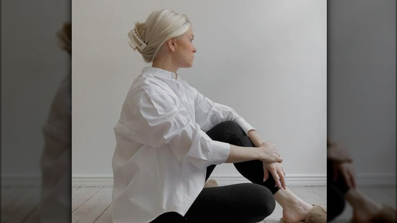 Woman in white sitting