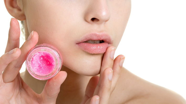woman using lip scrub