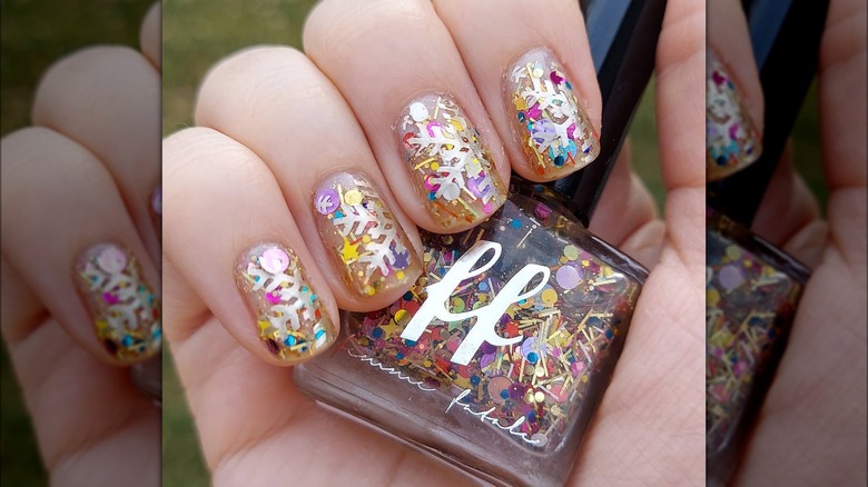 nails with snowflakes and glitter flecks