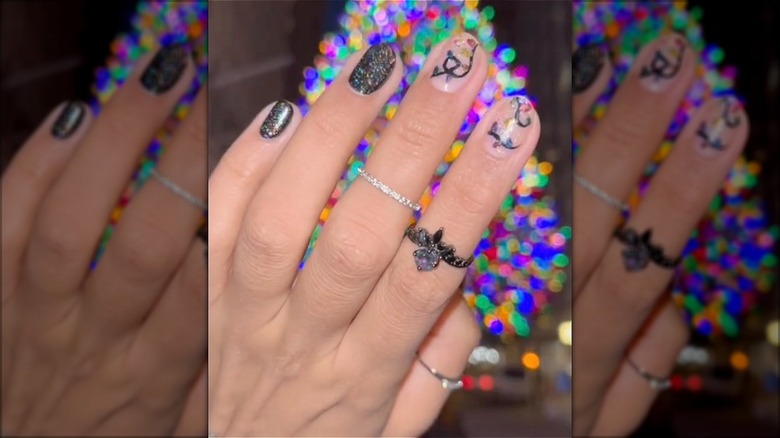 hand with christmas light nails