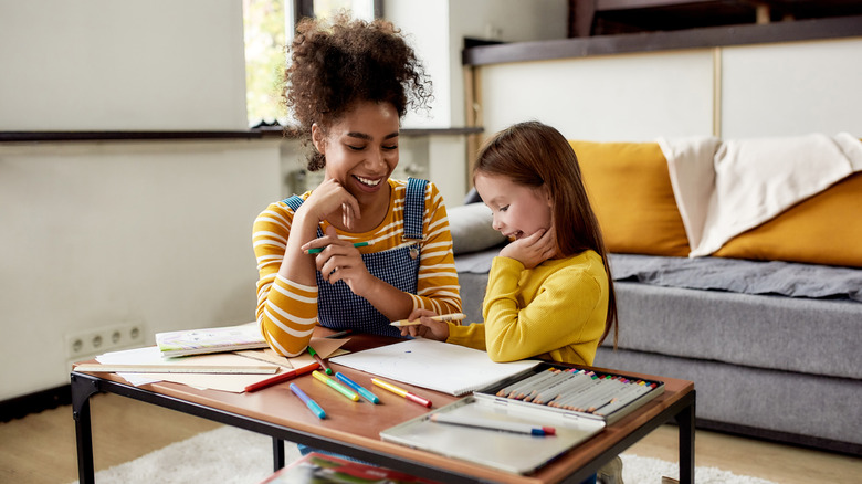 woman babysitting little girl