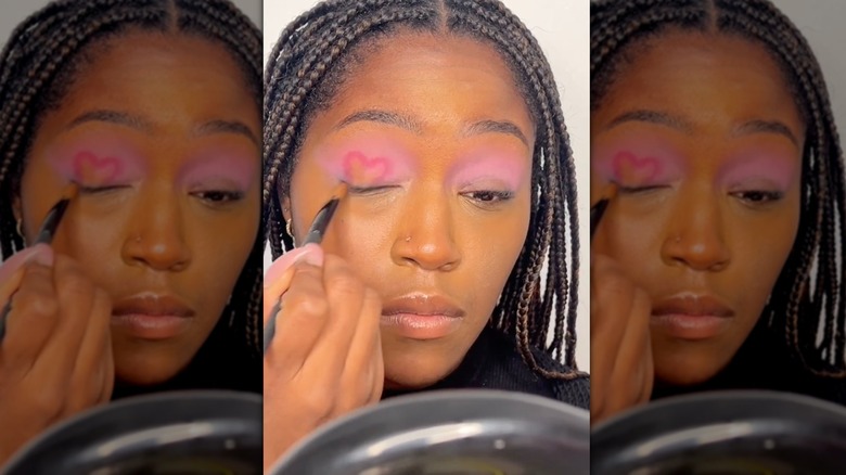 Aniyah S. drawing heart makeup