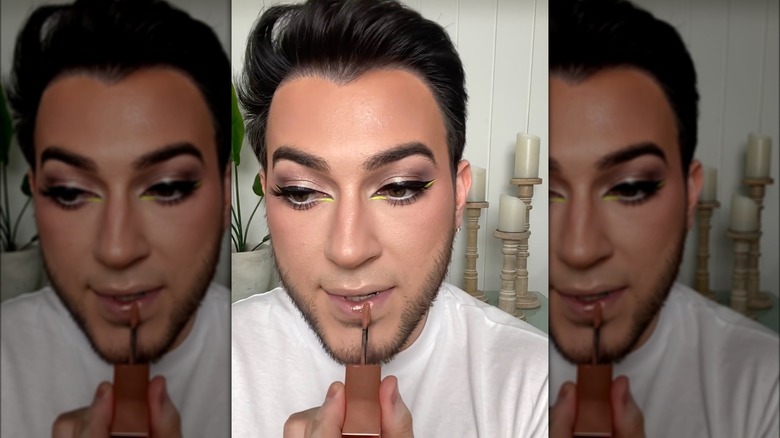 Manuel Gutierrez Jr. doing his makeup